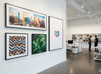 SEG Wall Art with black aluminum frame and vibrant fabric graphics in modern office and retail setting